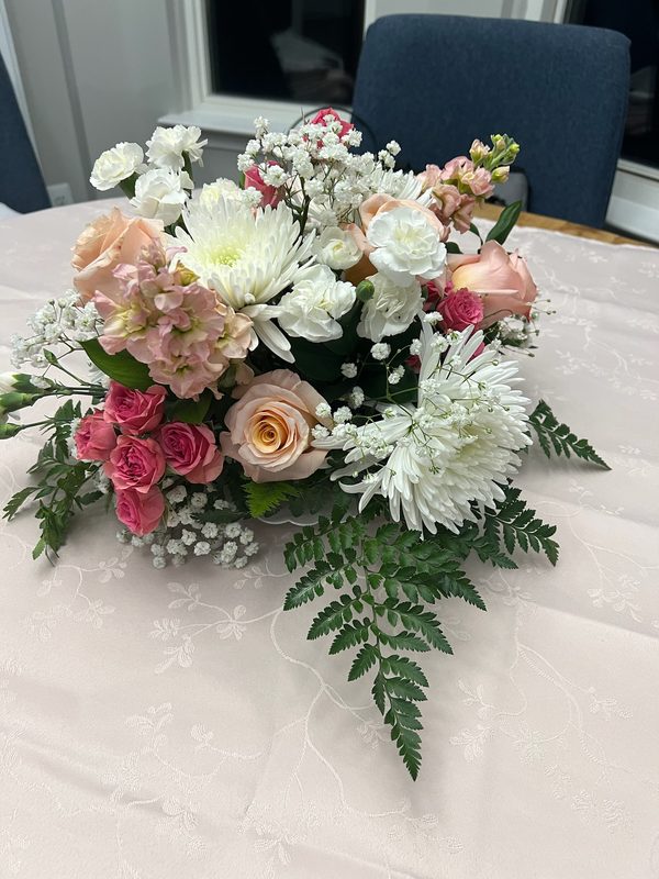 Pink roses, white mums and baby's breath arrangement